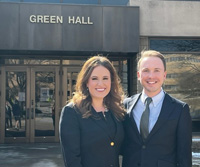 Emily Depew, left, and Douglas Bartel, right, in front of Green Hall