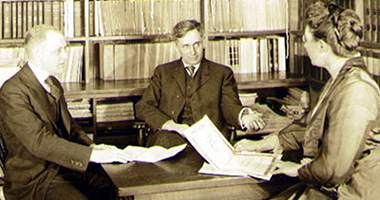 Louis Brandeis, center, is pictured in his office.