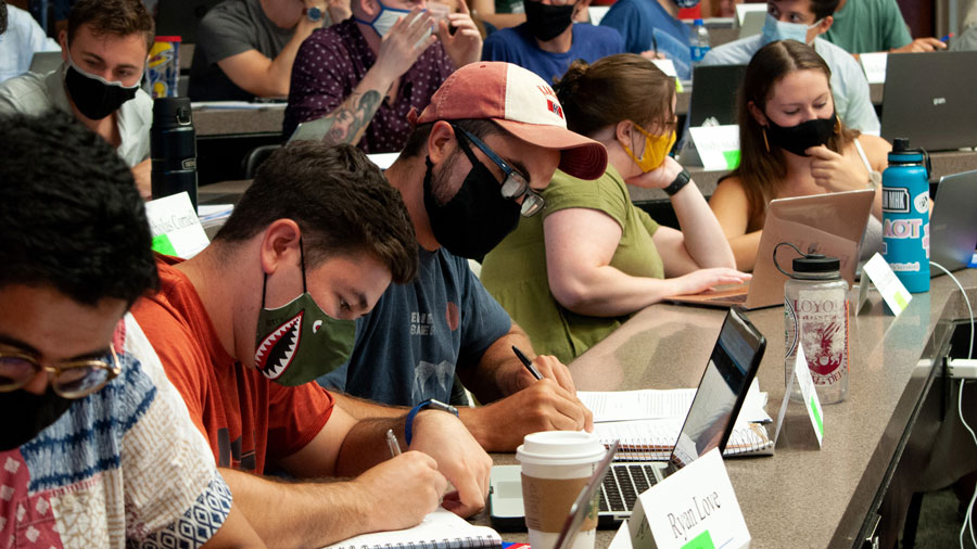 Students collaborate on an assignment during class