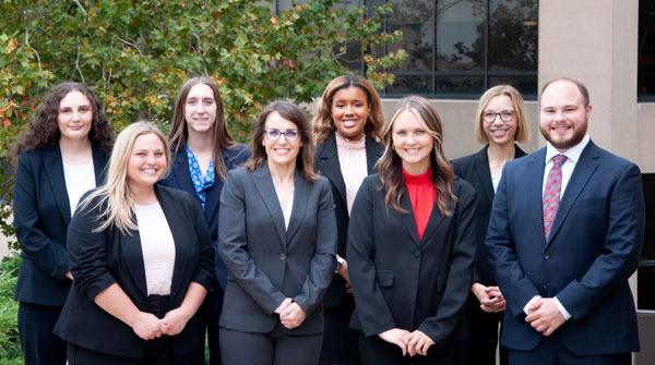 Members of the 2022-23 Shook, Hardy & Bacon Advocates program pose for a group photo outside of Green Hall