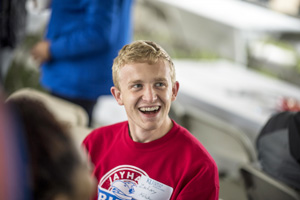 Zachary Kelsay laughs while talking at a KU Law homecoming tailgate