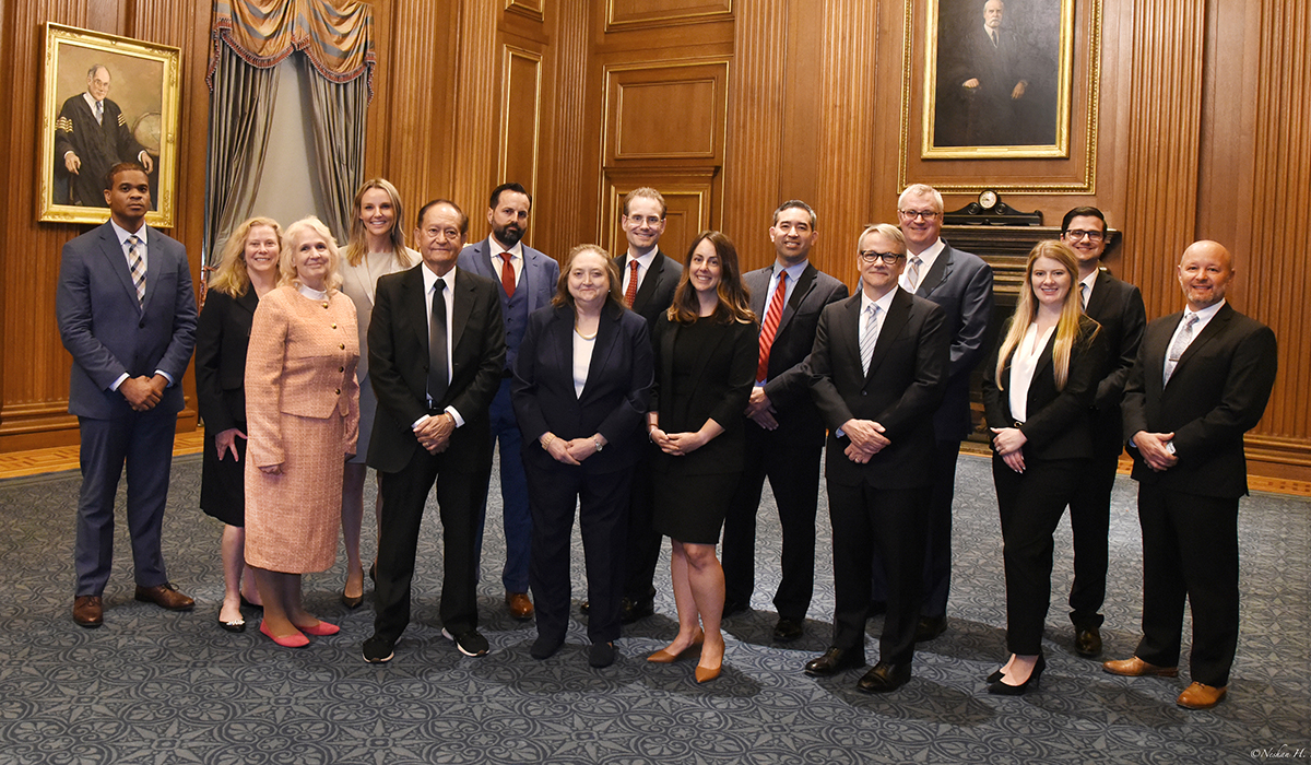 Group photo of University of Kansas School of Law alumni inside the U.S. Supreme Court.