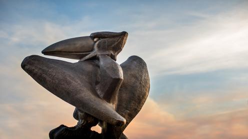 Jayhawk statue and sunset